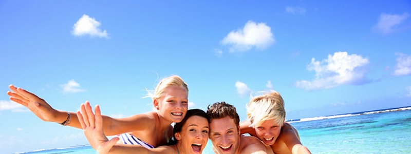 family having fun on the beach