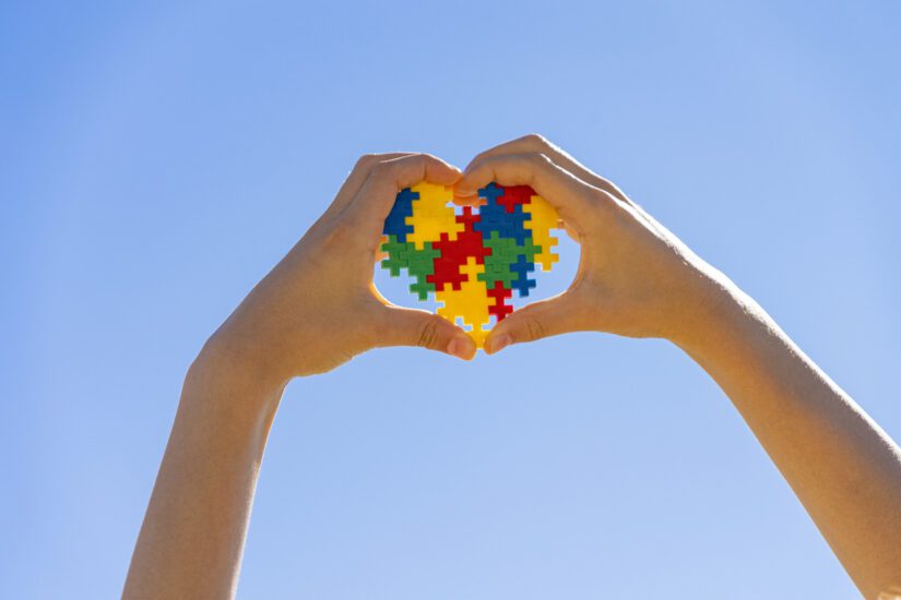 hands holding autism heart